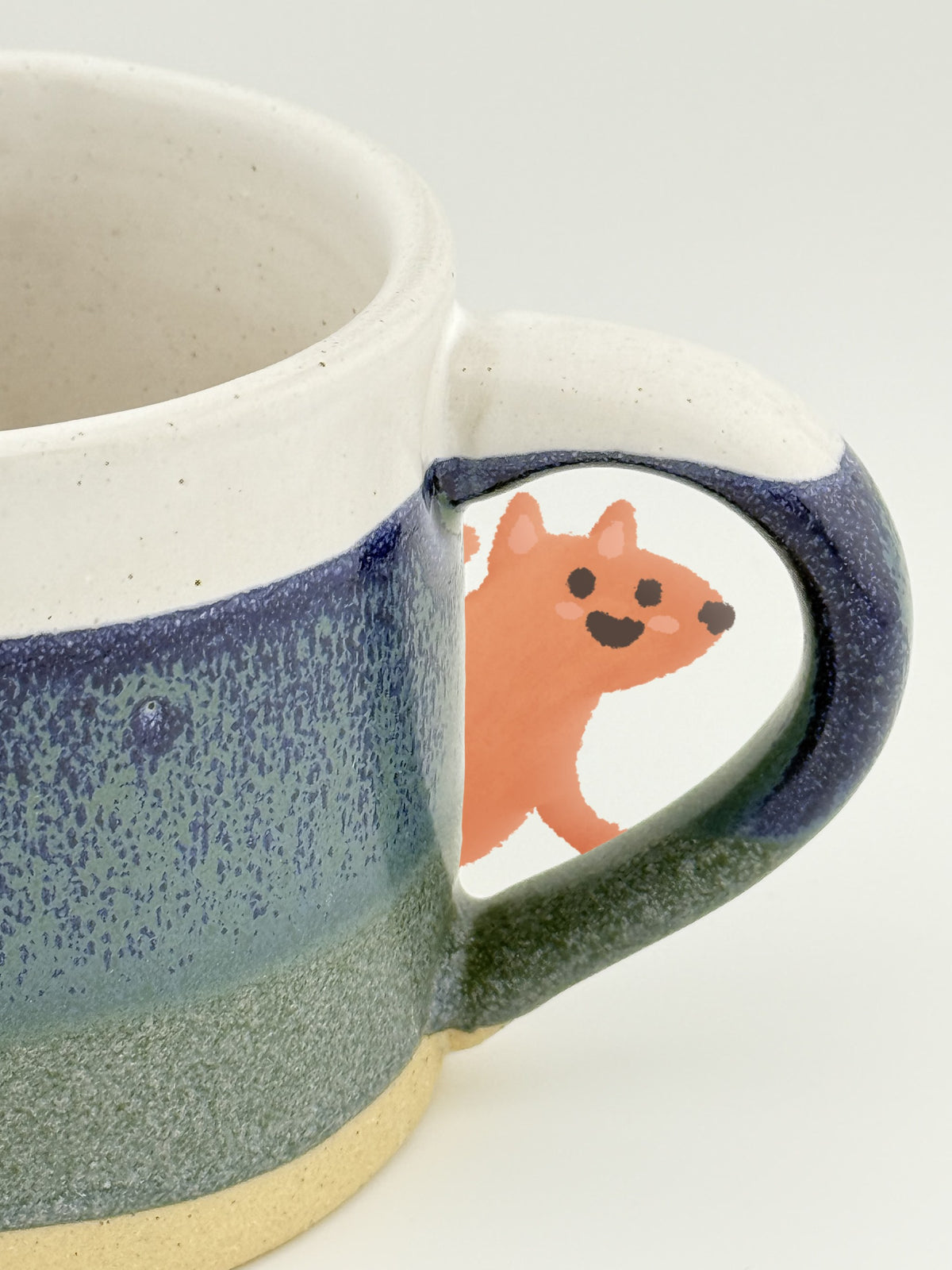 Marlowe Mug Blue with the Glimmers fox peeking through the handle
